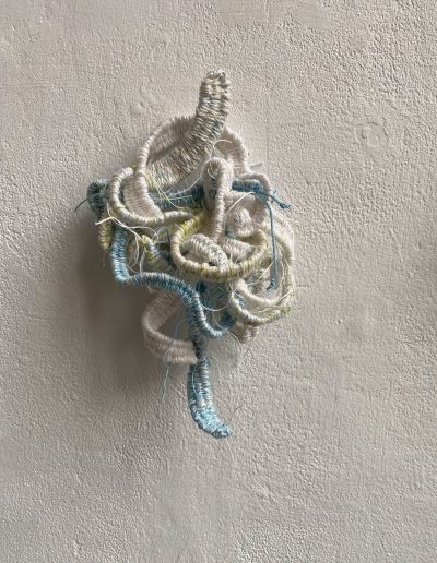 White knot. 13cm x 20cm x 6cm. Woven tapestry.